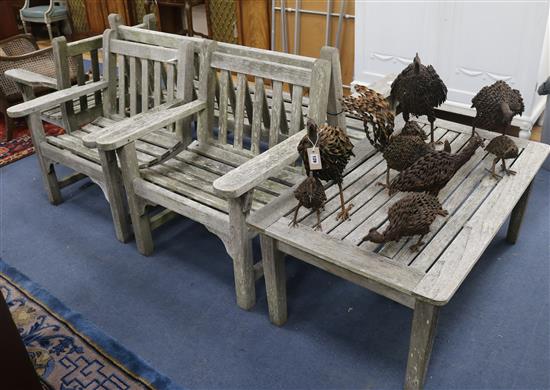A Teak garden bench, 3 armchairs and a table W.161cm